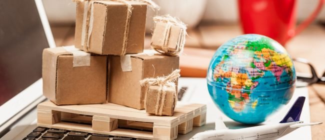 Global logistics concept with online trading and shopping in the internet, packages to be delivered after ordering on the computer